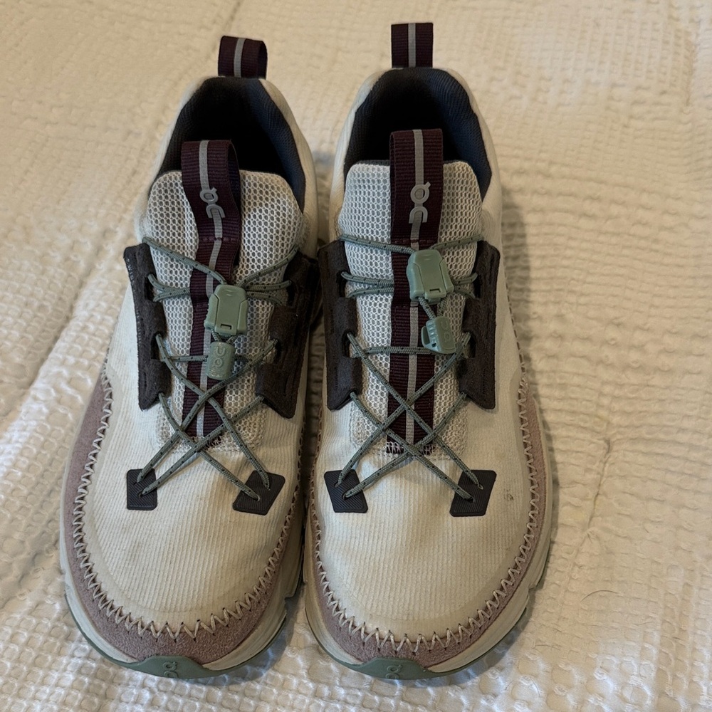 On Running Cream and Brown Sneakers